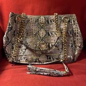 Valentino handbag. Stain in zippered compartment as shown in picture.